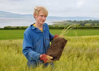 Staff member holding soil core