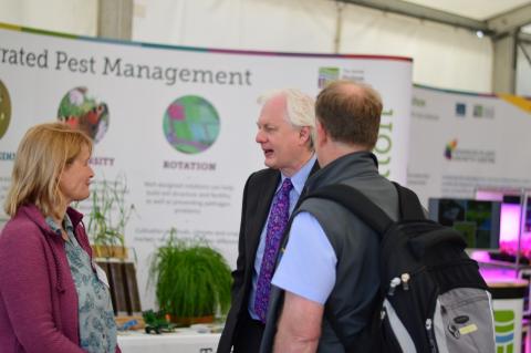 IPM@Hutton members talking about IPM research at the James Hutton Institute with a member fo the public and the 2019 Royal Highland Show IPM@Hutton members talking about IPM research at the James Hutton Institute with a member fo the public and the 2019 Royal Highland Show